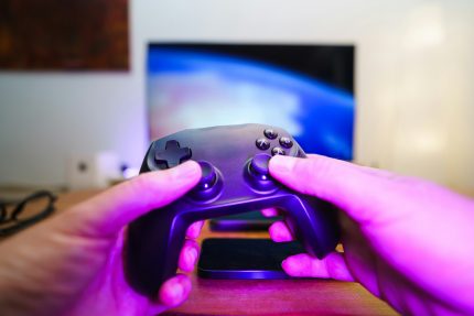 4K HDMI retro game console with wireless controller connected to TV